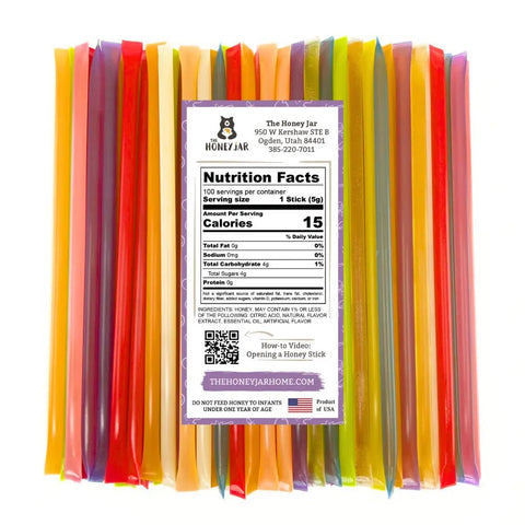 Colorful honey sticks with a nutrition facts label on a white background