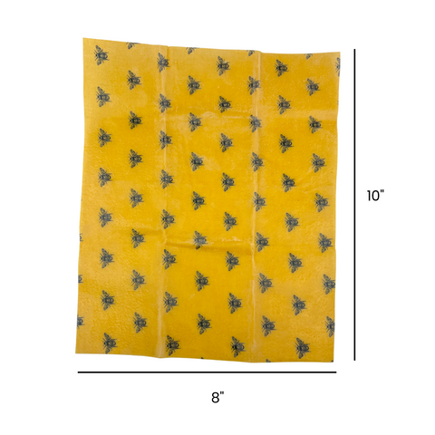 Yellow fabric with black bee pattern and measurements on a white background