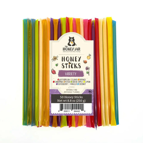 Pack of colorful honey sticks with 'The Honey Jar' label on a white background