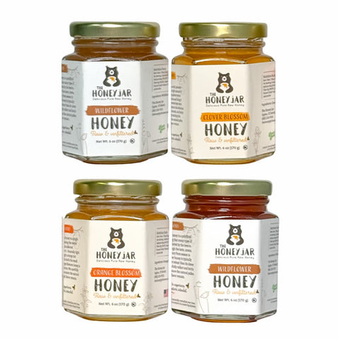 Four jars of honey from The Honey Jar on a white background