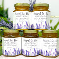 Five jars of honey with personalized labels featuring lavender designs on a white background.