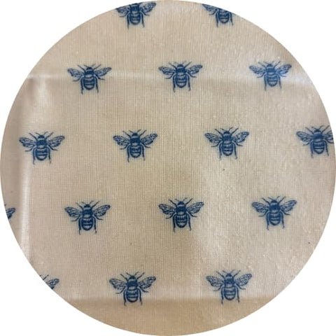 Round beige fabric patch with blue bee pattern