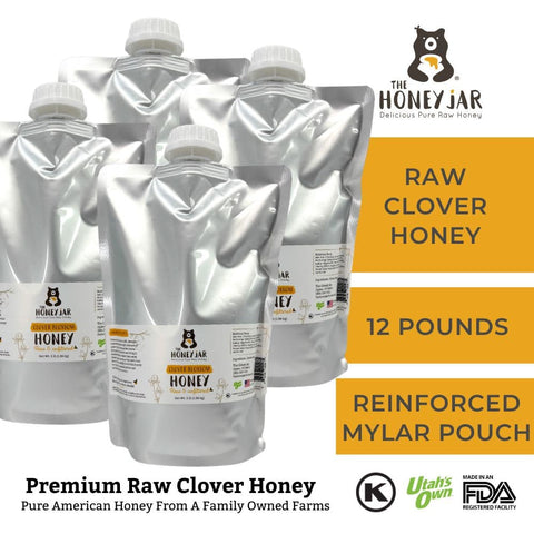 Packages of raw clover honey with The Honey Jar branding on a white background
