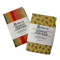 Two beeswax food wraps with stripe and bee patterns from The Honey Jar on a white background