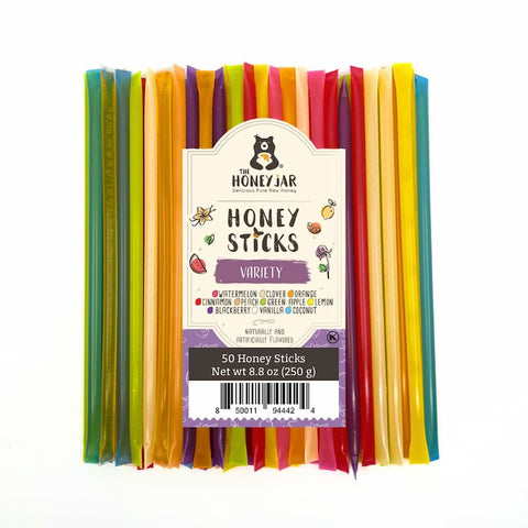 Pack of colorful honey sticks with 'The Honey Jar' label on a white background