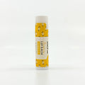 Vanilla lip balm with yellow and white design on a white background