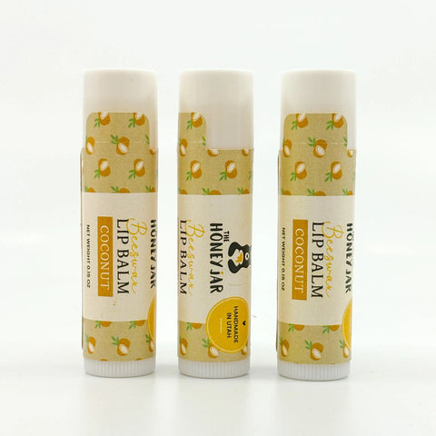 Three lip balms with coconut design on a white background