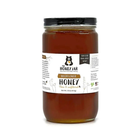 Jar of honey with a label on a white background
