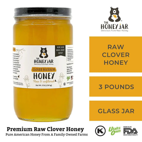 Jar of raw clover honey with 'The Honey Jar' branding on a white background