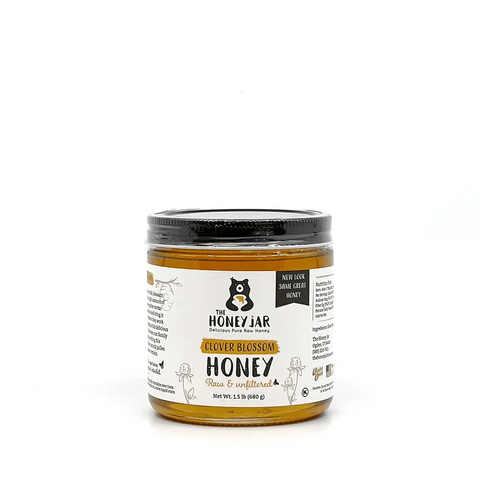 Jar of honey with a label on a white background