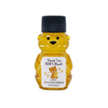 Bear-shaped honey bottle with a personalized label on a white background