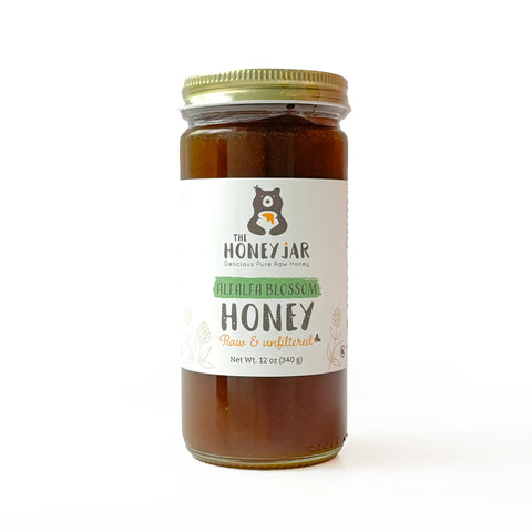 Jar of honey with a label on a white background