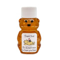 Honey bear bottle with a Winnie the Pooh-themed label on a white background