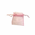 Pink organza bag on a white background