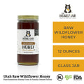 Jar of raw wildflower honey with The Honey Jar branding on a white background
