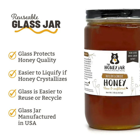 Jar of honey with a label on a white background, featuring text about reusable glass jars.