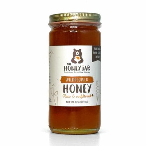 Jar of honey from The Honey Jar on a white background