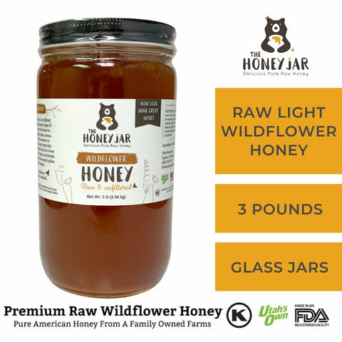 Jar of honey with 'The Honey Jar' label on a white background