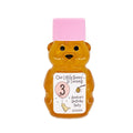 Bear-shaped honey bottle with pink cap and personalized label on a white background