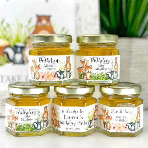 Jars with personalized labels on a white surface with a blurred background