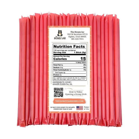 Pack of pink honey sticks with a nutrition facts label on a white background