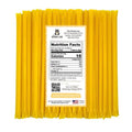 Yellow honey stick packaging with a nutrition facts label on a white background