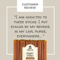 Honey sticks with a label and text about addiction to the product on a beige background