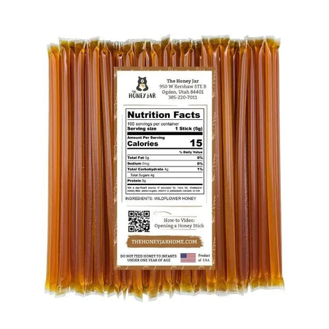 Pack of honey sticks with a label displaying nutrition facts and branding information.
