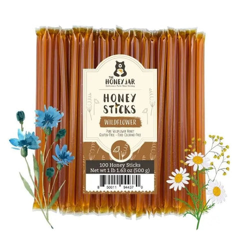 Pack of honey sticks with a label on a white background, surrounded by flowers.