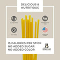 Product packaging with yellow honey sticks, nutritional information, and branding on a beige background