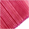 Close-up of pink honey sticks with a white background