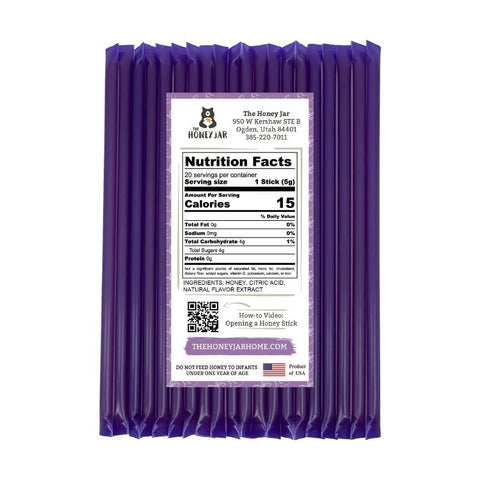 Purple honey stick packaging with nutrition facts label on a white background