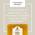 Honey sticks packaging with a customer review quote on a beige background