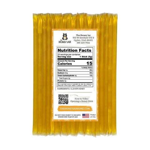 Honey sticks with a label displaying nutrition facts and product details on a white background.