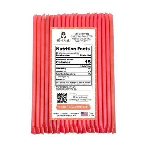 Pack of pink honey sticks with a nutrition facts label on a white background