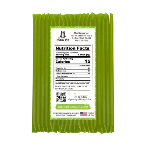 Green honey stick packaging with nutrition label on a white background