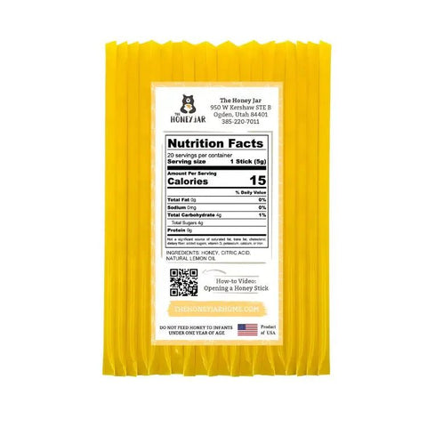 Yellow honey stick packaging with nutrition facts label on a white background