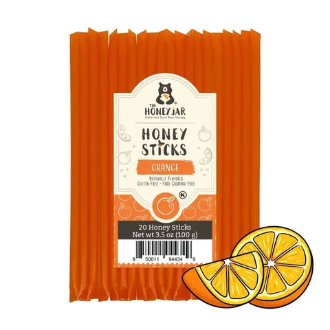 Pack of orange honey sticks with a label on a white background