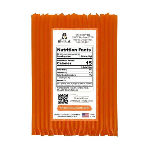 Orange honey stick packaging with a nutrition facts label on a white background