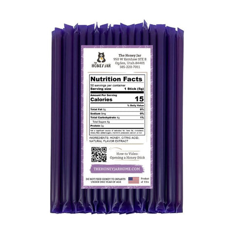 Purple package of honey sticks with nutrition facts label on a white background