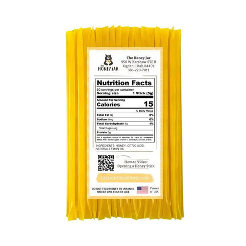 Yellow honey sticks with a nutrition facts label on a white background