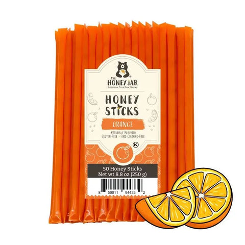 Pack of orange honey sticks with a label on a white background