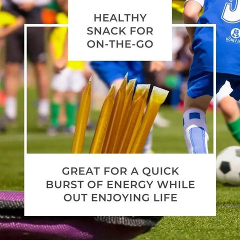 Honey sticks on a sports field with text about a healthy snack for on-the-go.