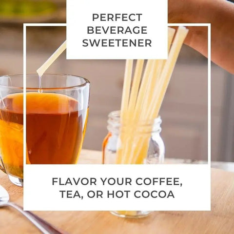 Glass of hot beverage with honey from a honey stick being added, text overlay promoting sweetener for coffee, tea, or hot cocoa.