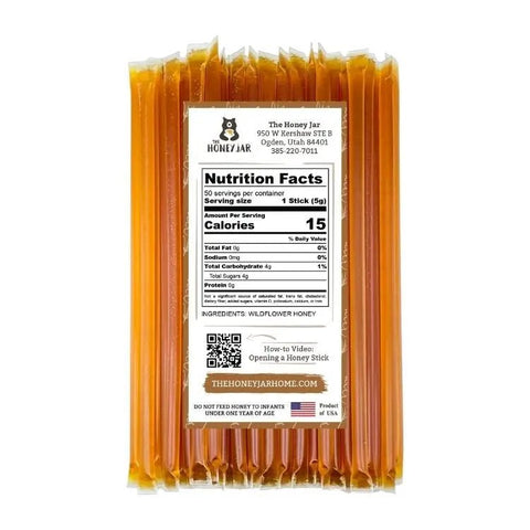 Packaged honey sticks with a nutrition facts label on a white background