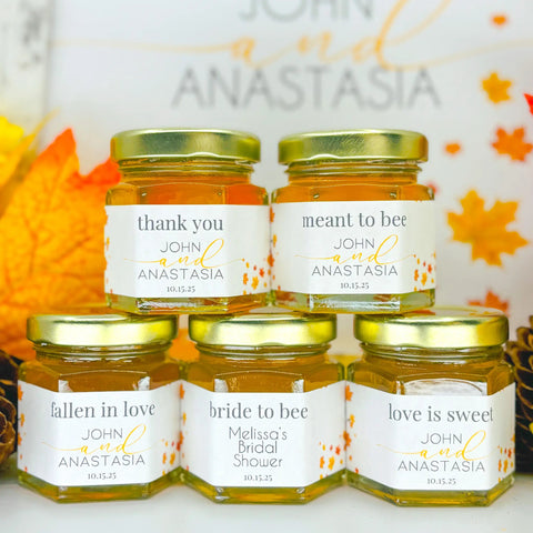 Jars of honey with personalized labels on a decorative background