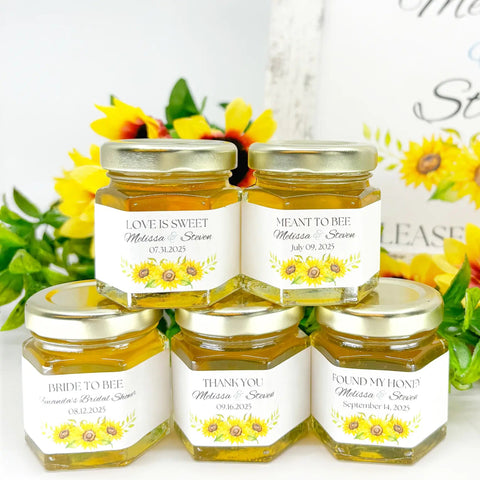 Five jars of honey with personalized labels on a white background with sunflowers.
