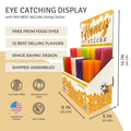 Display of honey sticks with packaging and features listed